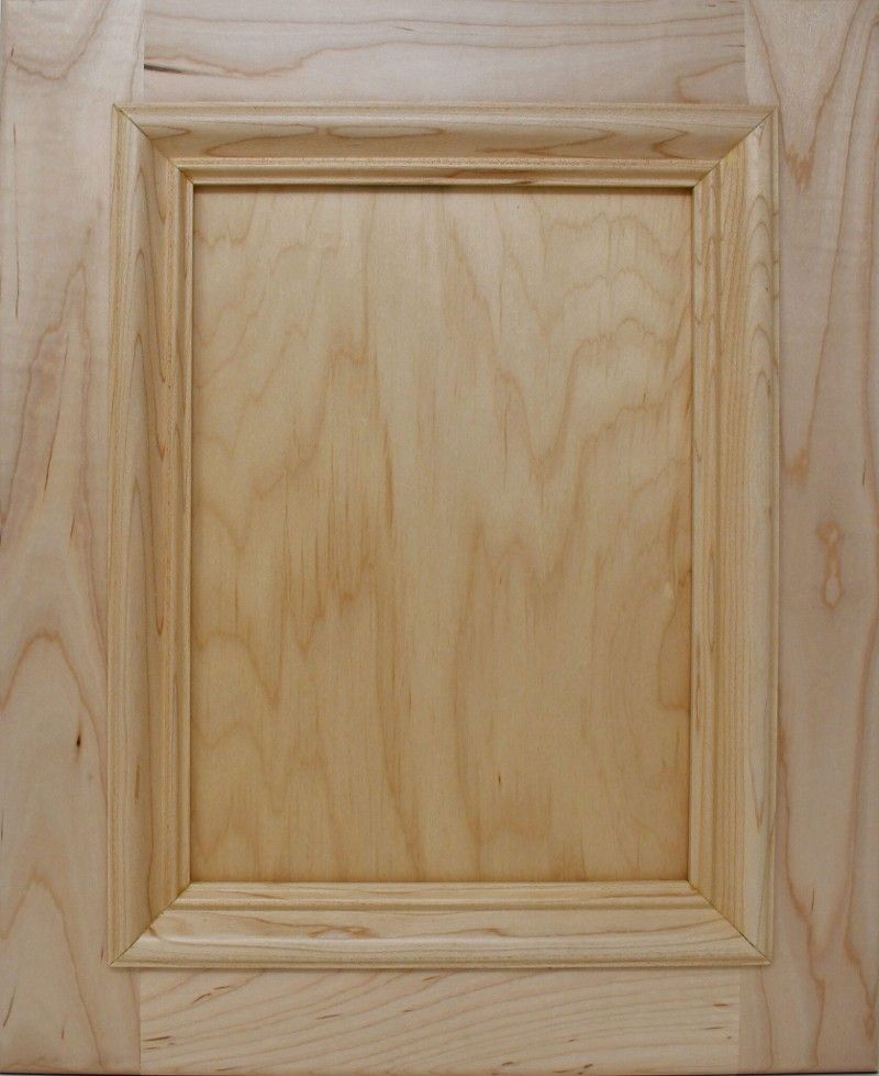 A close up of a wooden door with a wooden frame.