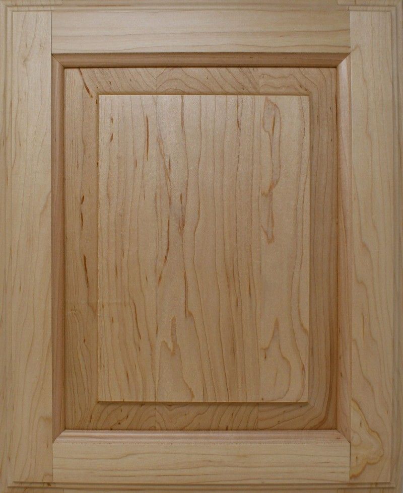 A close up of a wooden door with a square frame