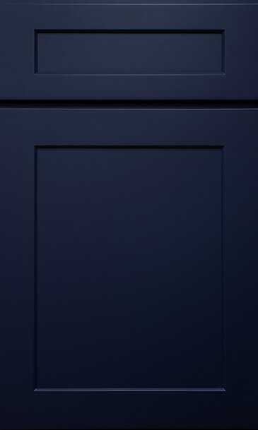 A close up of a dark blue cabinet door.