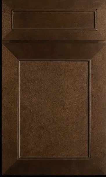 A close up of a brown cabinet door on a black background.