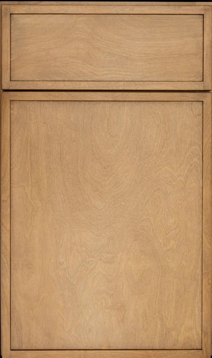 A close up of a wooden cabinet door on a black background.