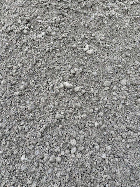Pile of gray gravel with varying sizes of stones.