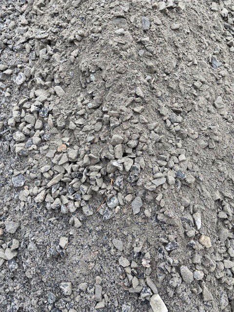 Pile of gray gravel and sand.