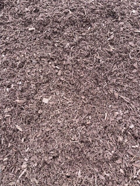 Close-up of brown wood chips and mulch covering the ground