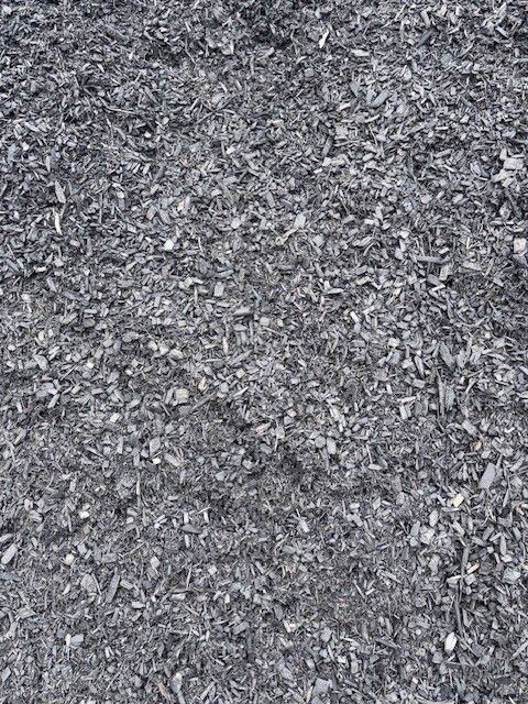 Close-up of gray gravel or crushed stone filling the frame.
