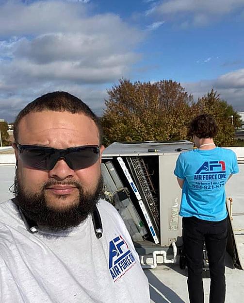 a man wearing sunglasses and a shirt that says air force one