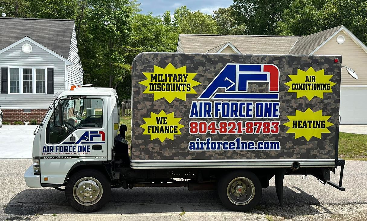 an air force one truck is parked in front of a house .