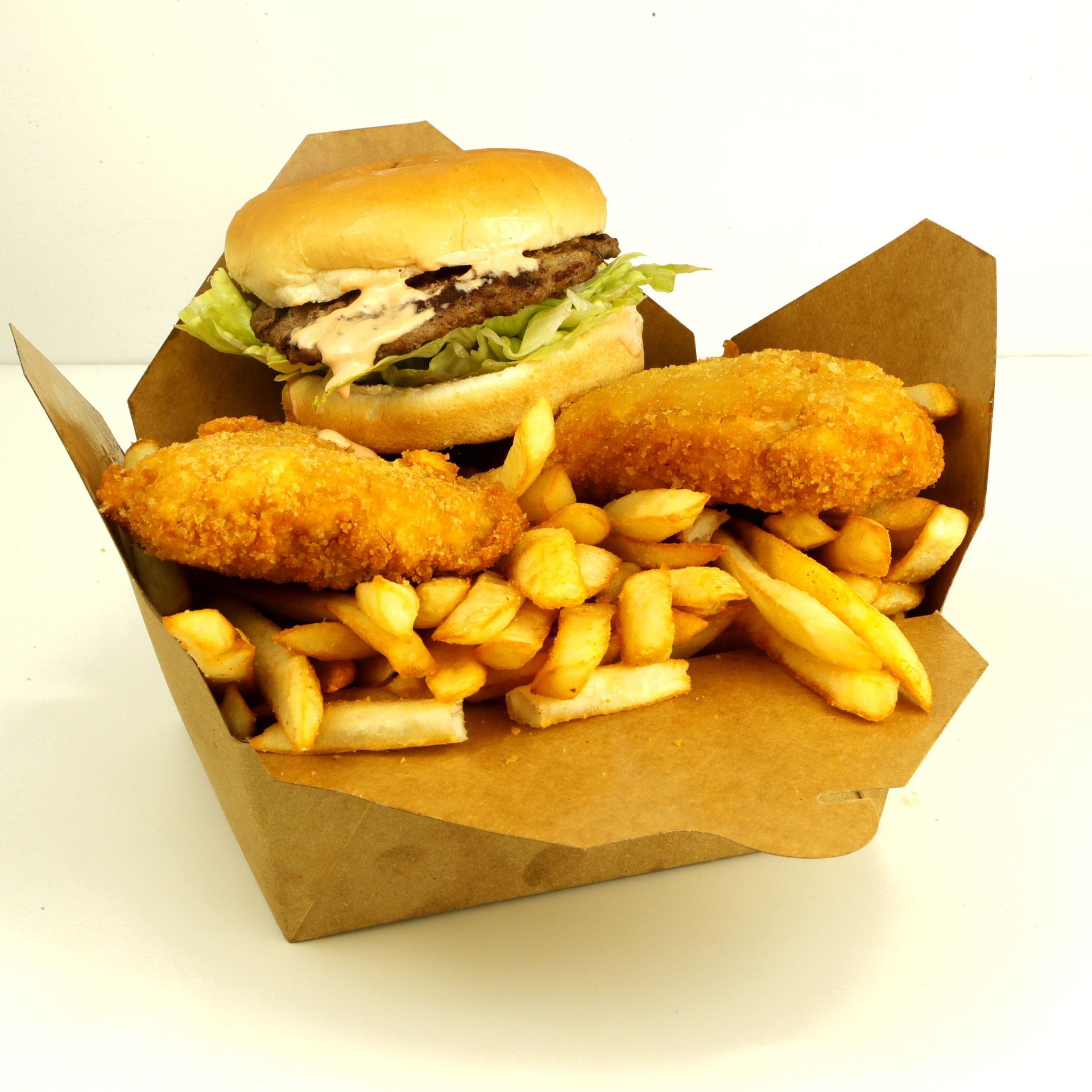 A fast-food meal in a cardboard container: burger wrapped in paper, fried chicken, and fries.