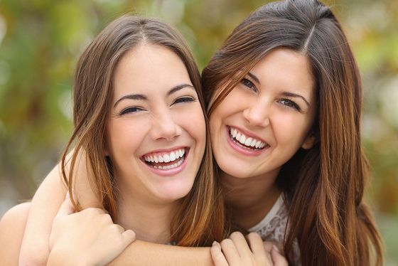 two women with perfect teeth