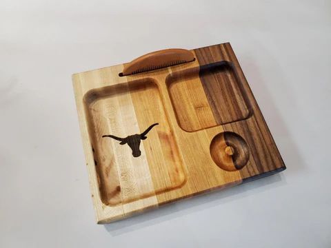 Wooden puzzle tray with cutout compartments and a bird silhouette