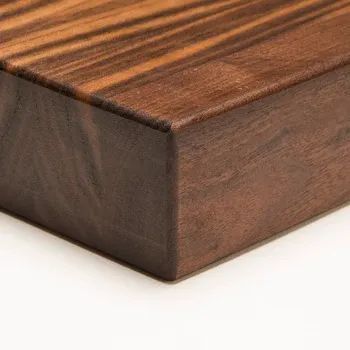A close-up of a smooth, dark brown walnut wood block with visible grain patterns against a plain white background.
