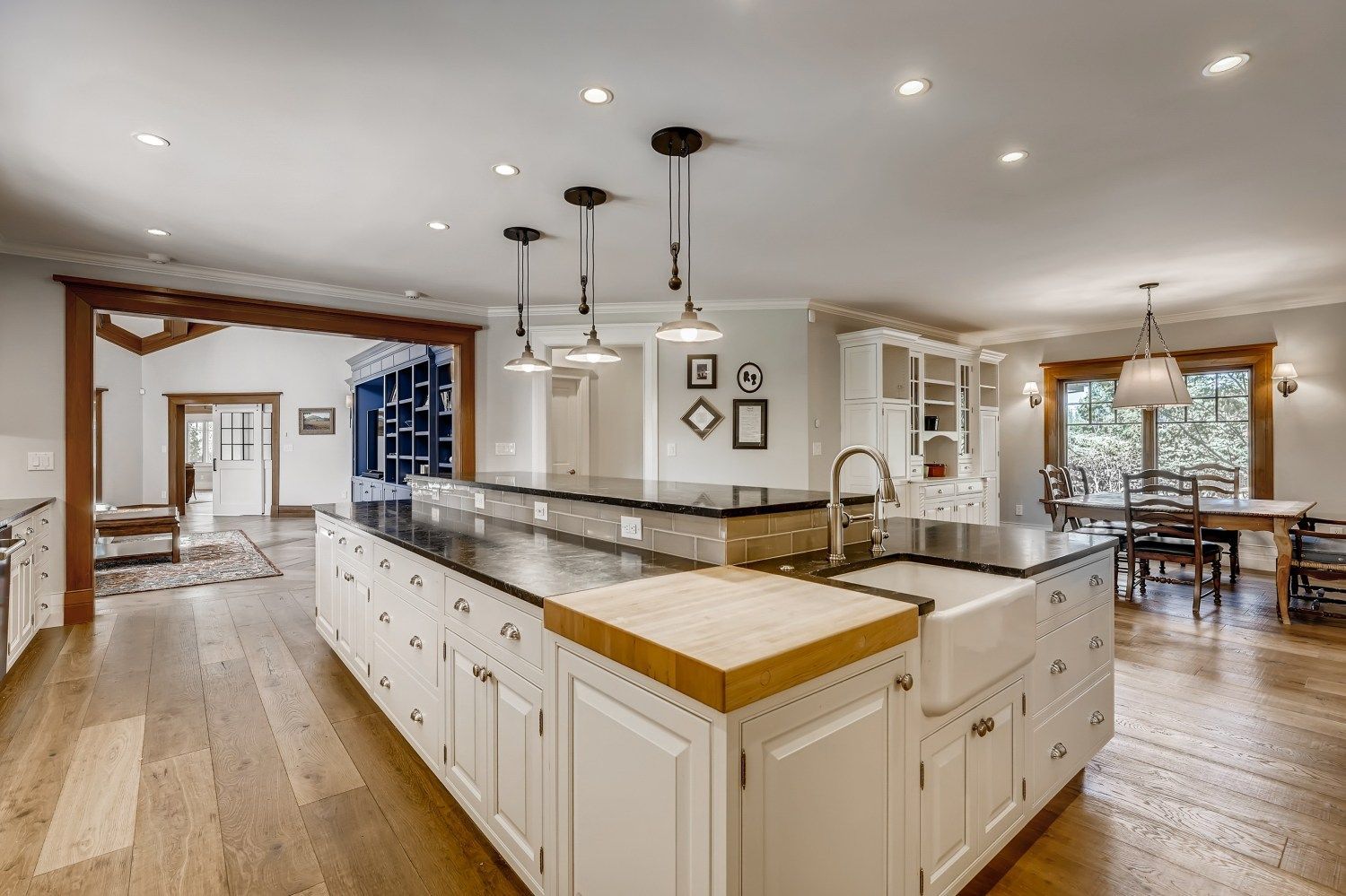 A large kitchen with a large island and a sink.