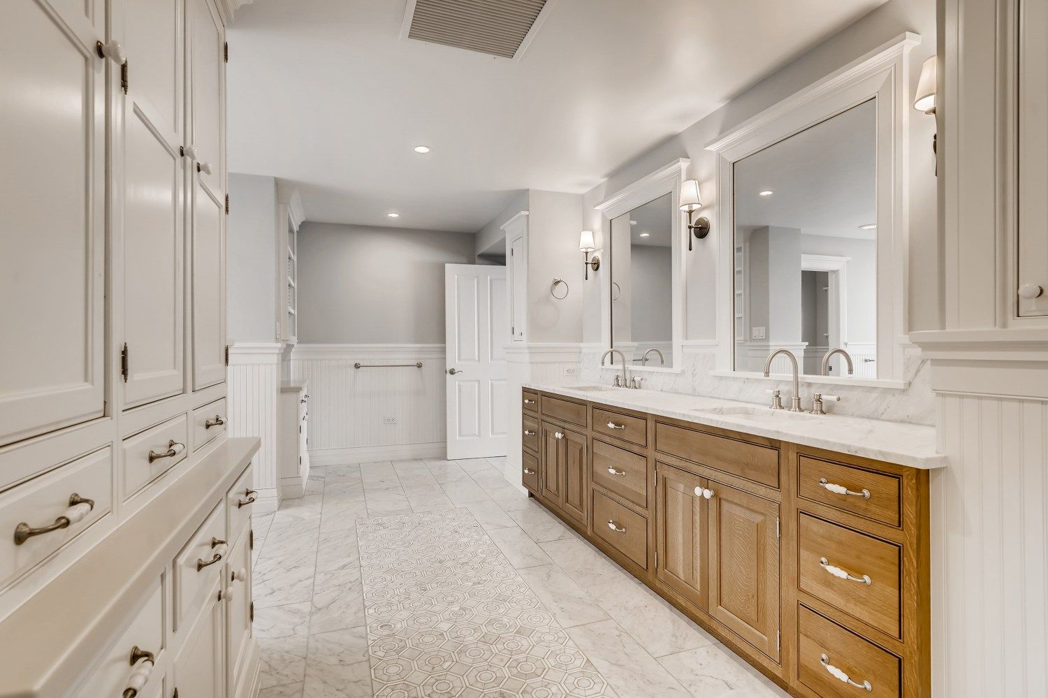 A bathroom with a tub, shower, and window.