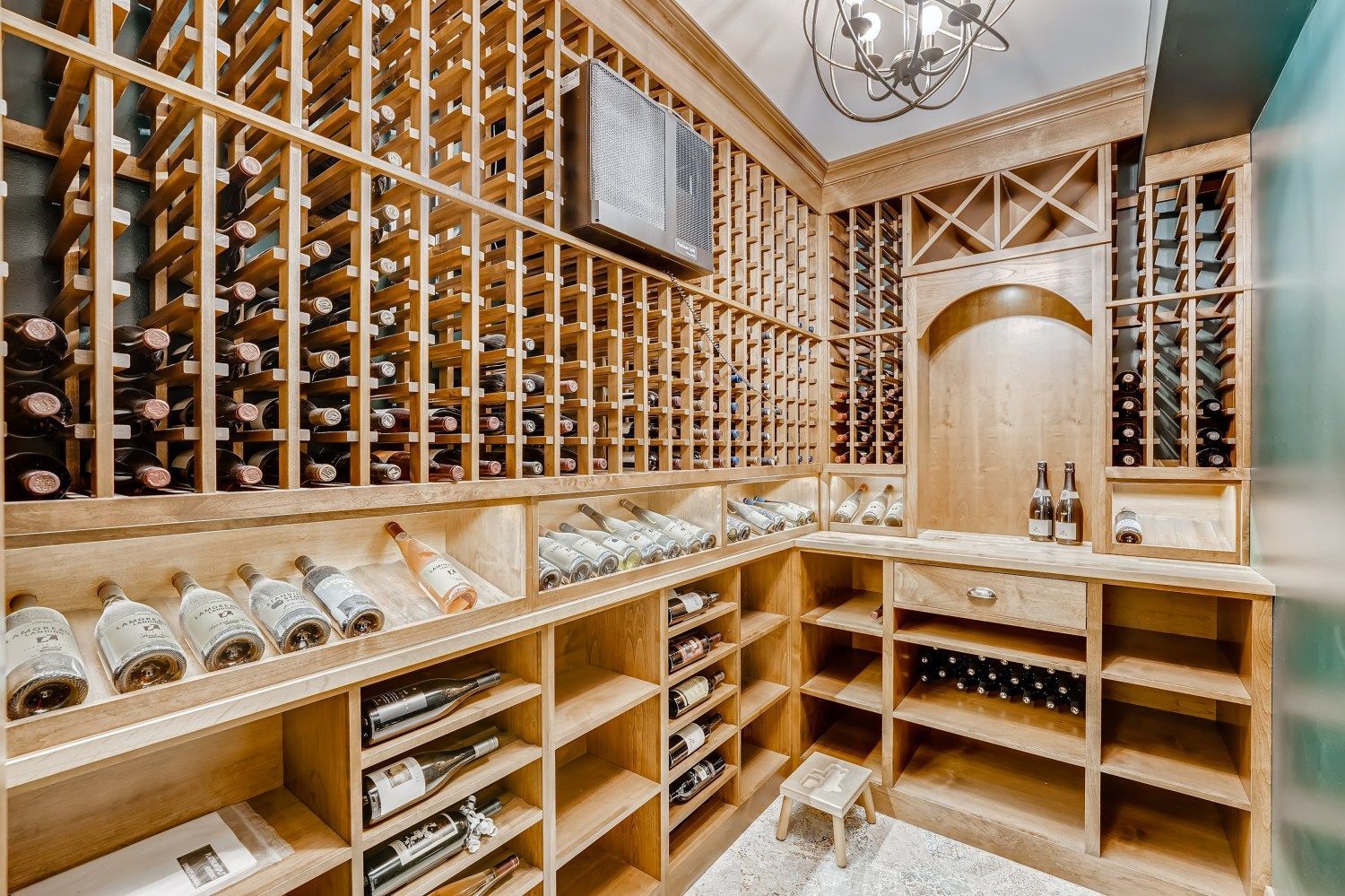 A large wine cellar filled with lots of bottles of wine.