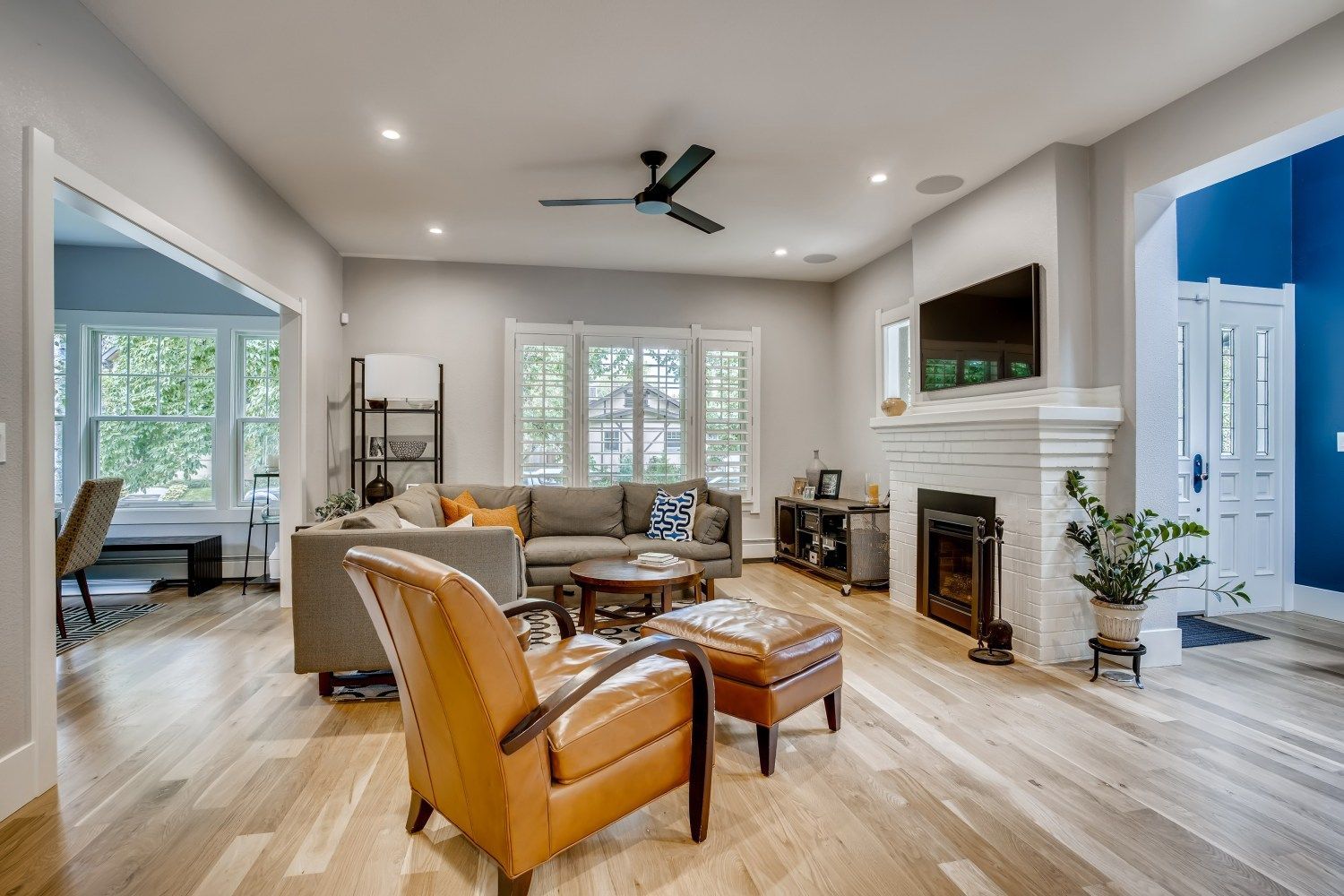 A living room filled with furniture and a fireplace.