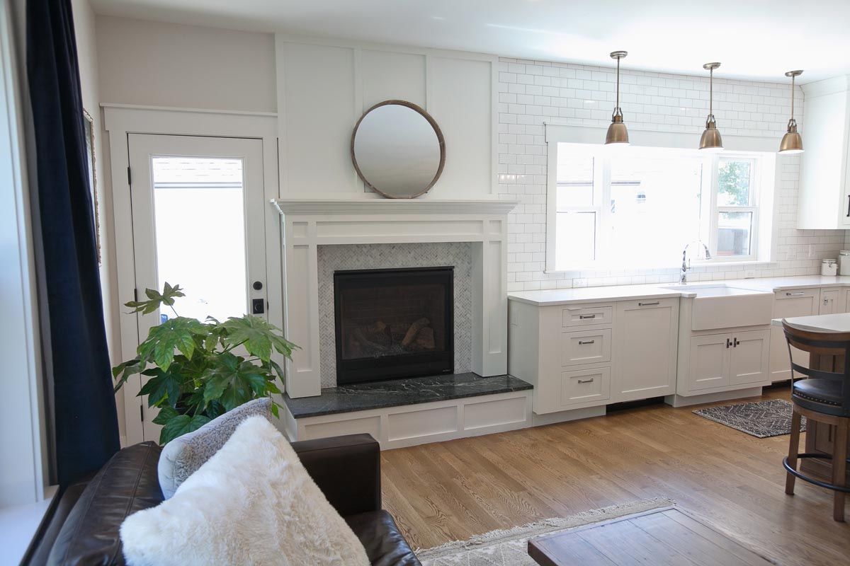 A living room with a fireplace and a couch.