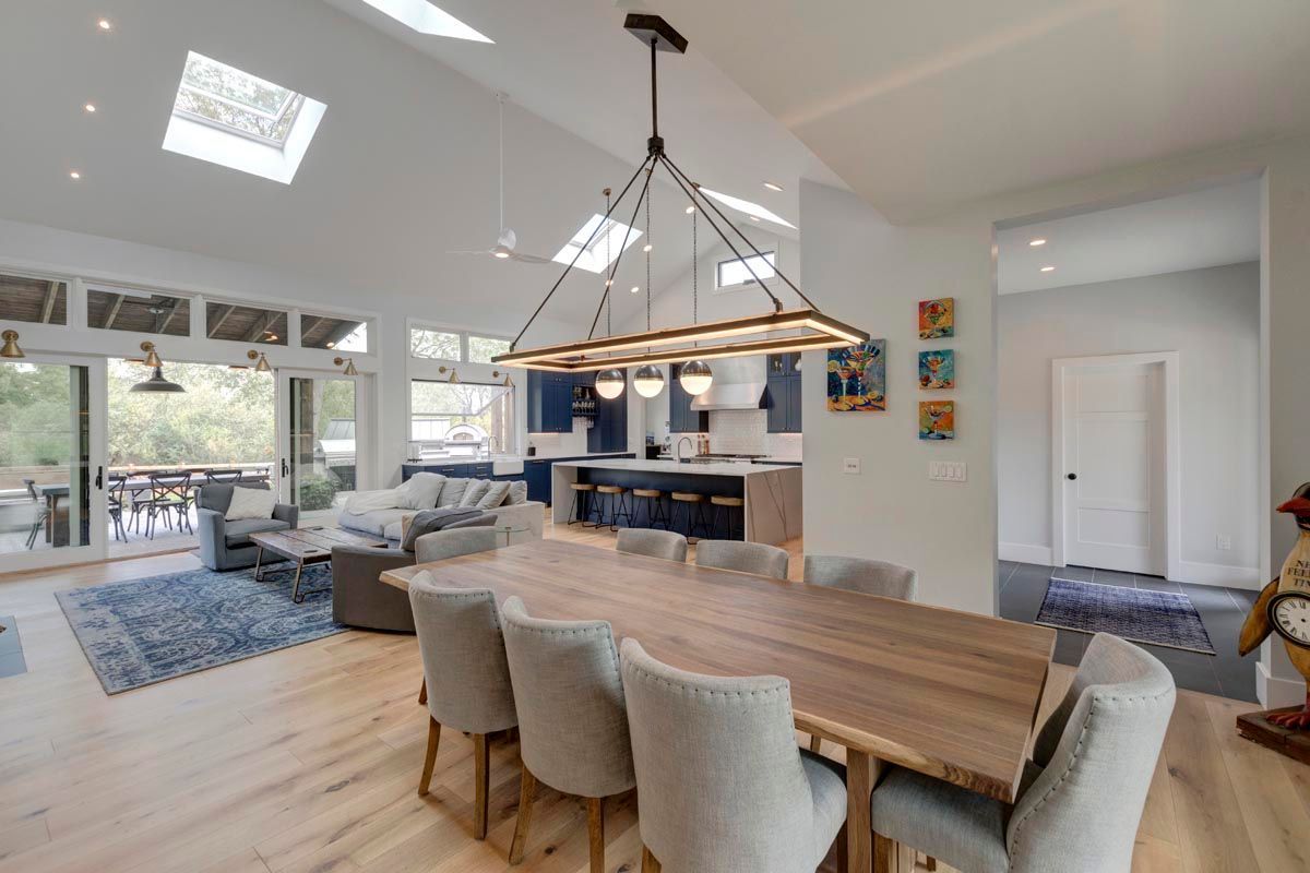 A house with a wooden bridge in front of it.