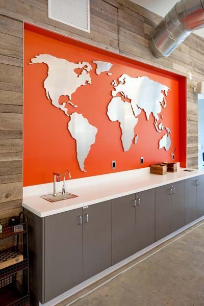 A wall with a map of the world on it.