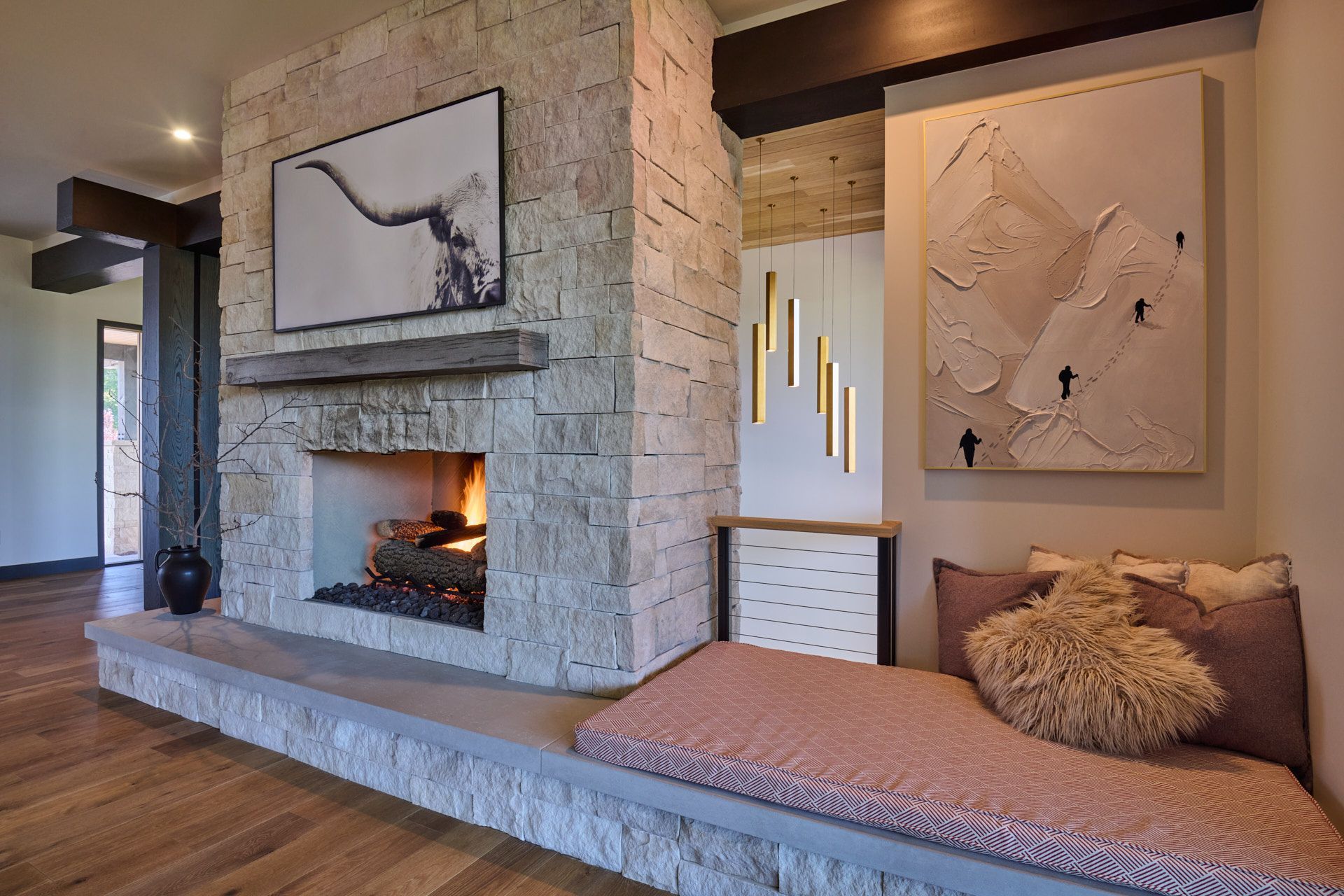 A living room with a fireplace and a bench in front of it.
