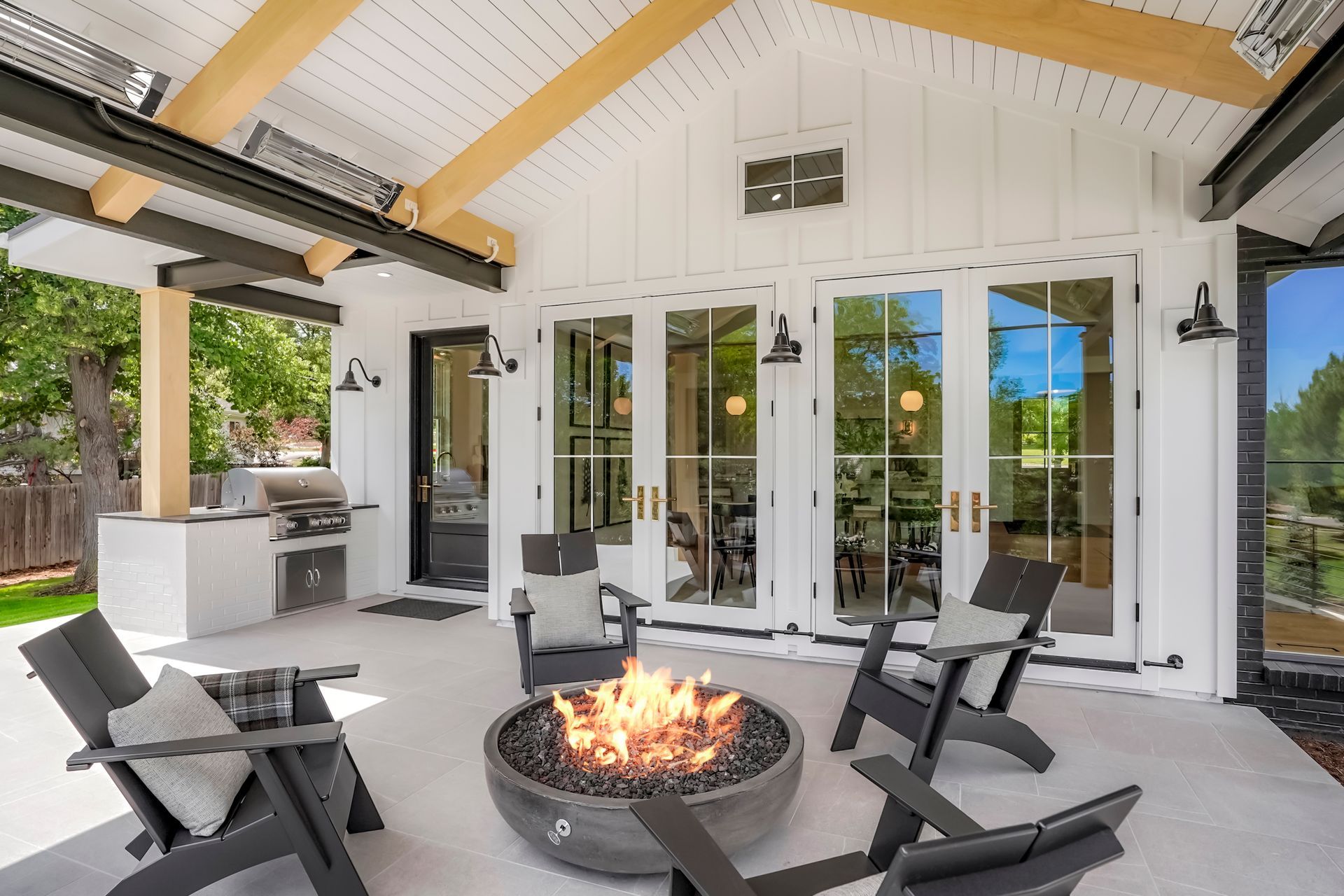 There is a fire pit in the middle of the patio.