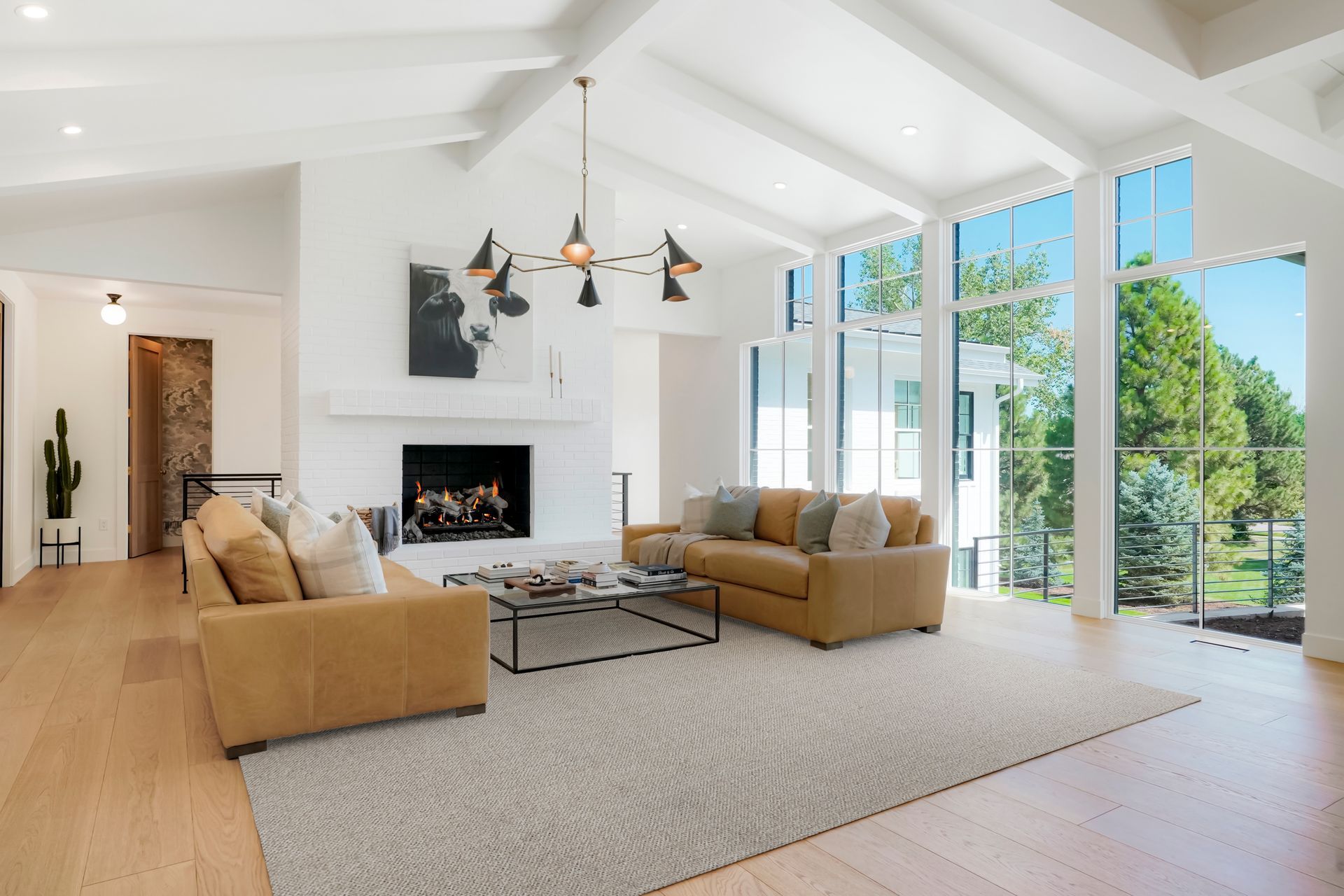 A living room filled with furniture and a fireplace.