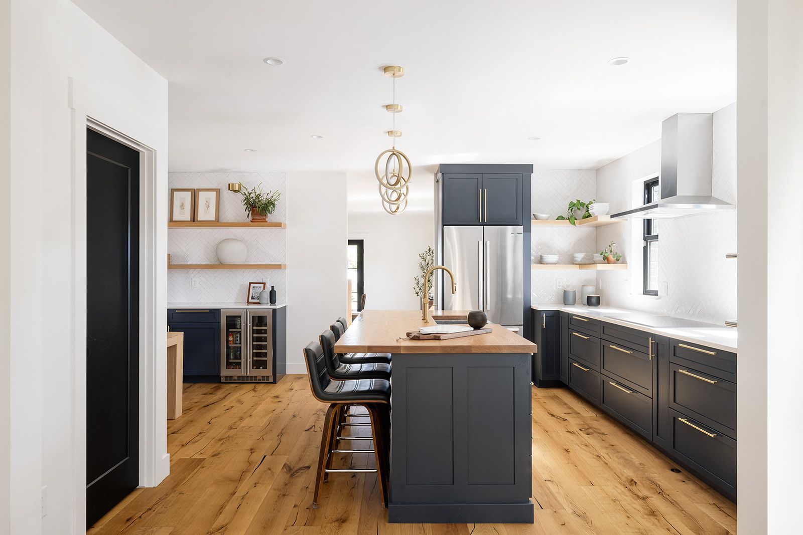 A kitchen with a large island in the middle of it.