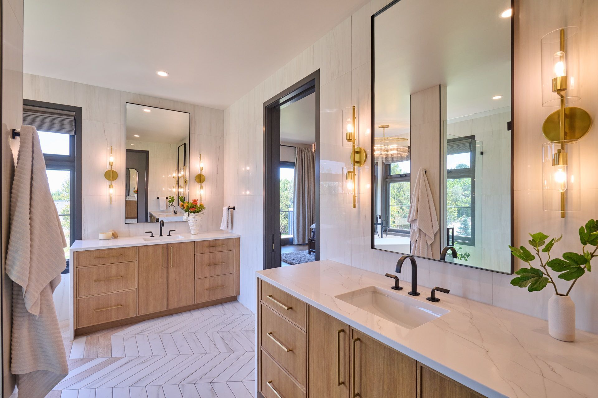 A bathroom with two sinks and two mirrors.