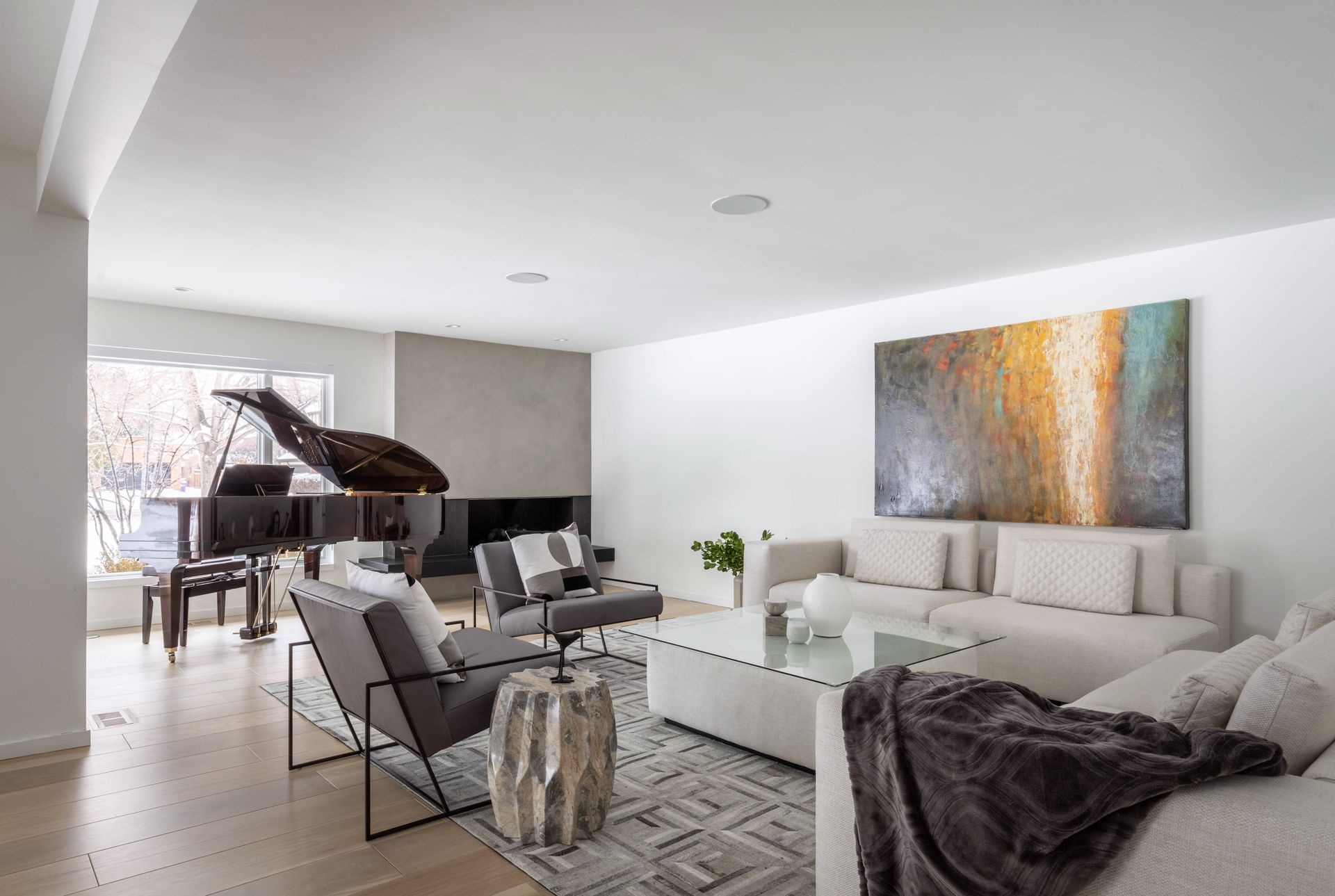 A living room filled with furniture and a piano.