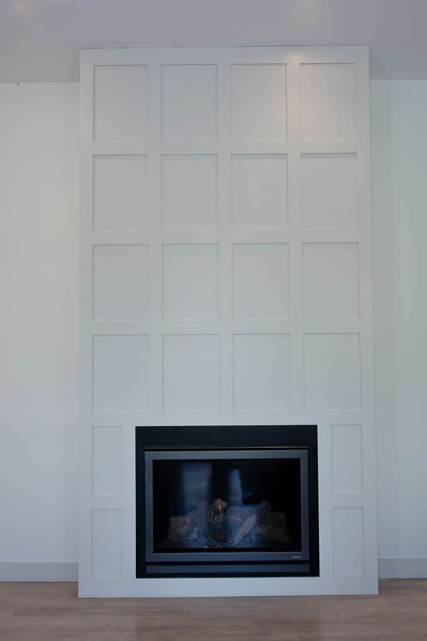 There is a fireplace in the middle of the room.