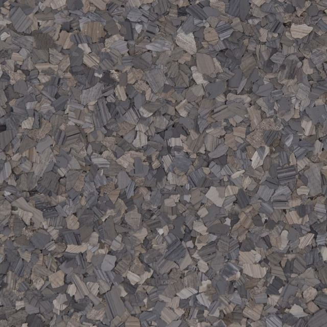 Gray and brown gravel stones filling the frame, creating a rough textured surface