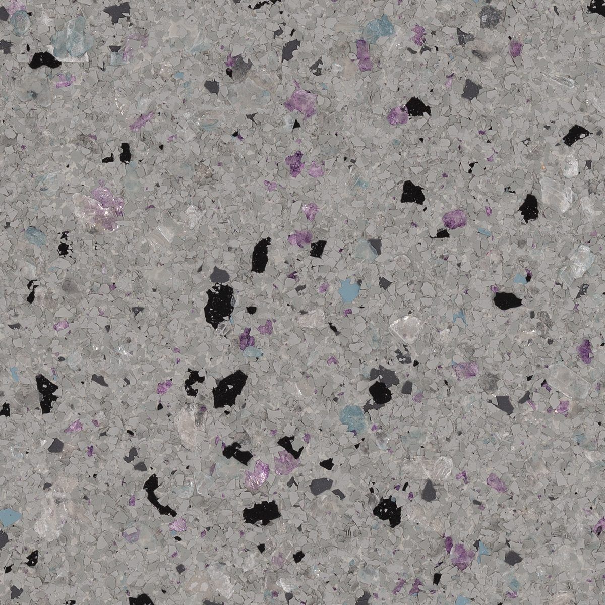 Gray speckled terrazzo surface with scattered black, purple, and white flecks
