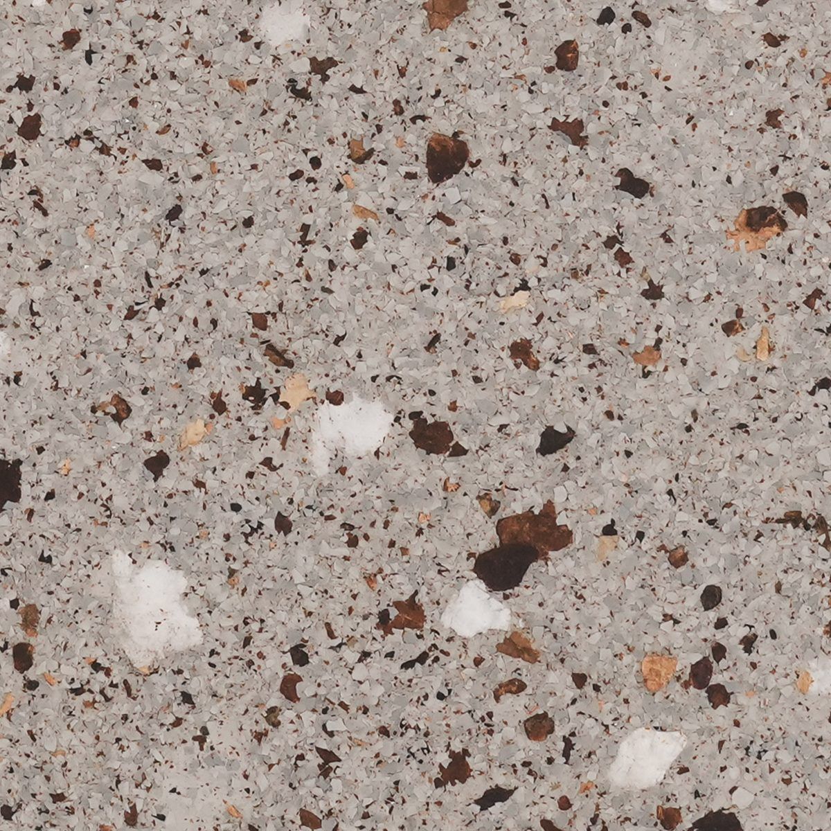 Close-up of speckled gray terrazzo with white, brown, and orange stone flecks.