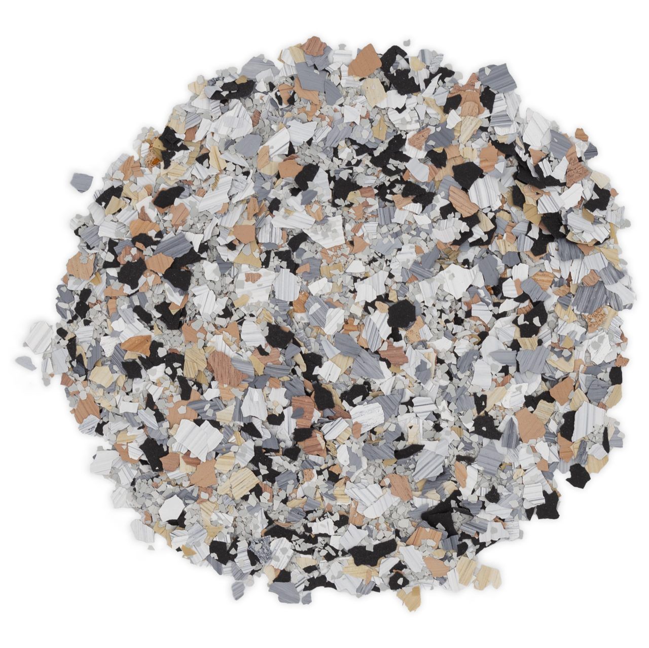 A pile of mixed gray, black, white, and tan confetti or flakes on a white background