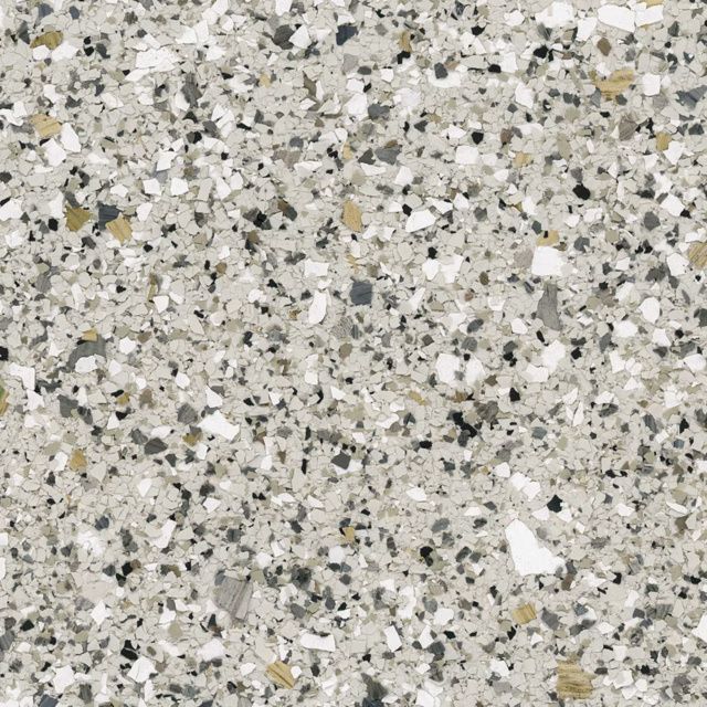 Speckled gray terrazzo or granite surface with white, black, and beige flecks