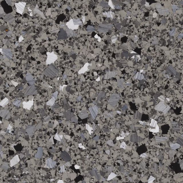 Gray speckled stone or terrazzo surface with scattered white, black, and dark gray flecks