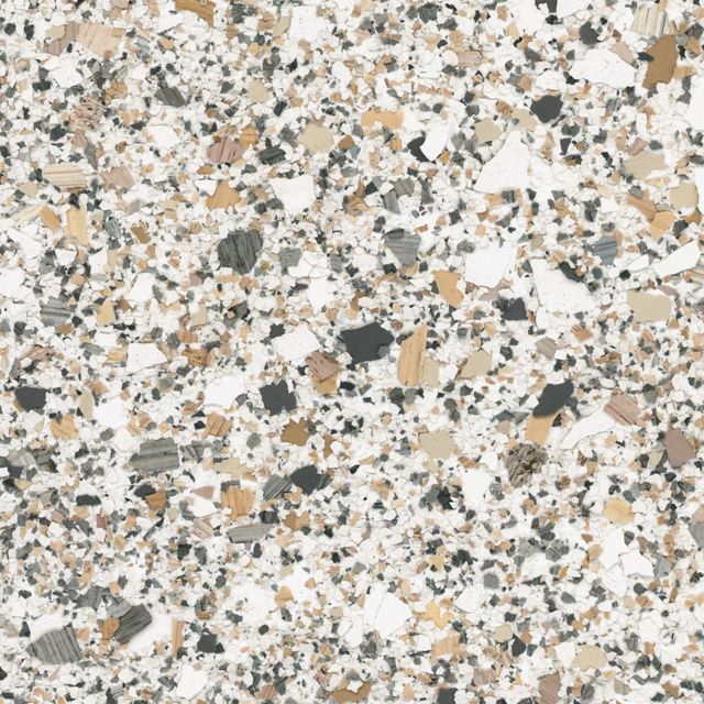 Speckled terrazzo surface with white, beige, gray, and black chips