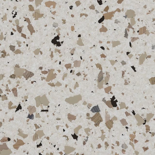 Speckled terrazzo surface with white, beige, gray, and brown chips