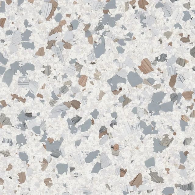 Close-up of light gray terrazzo flooring with white, gray, and tan chips