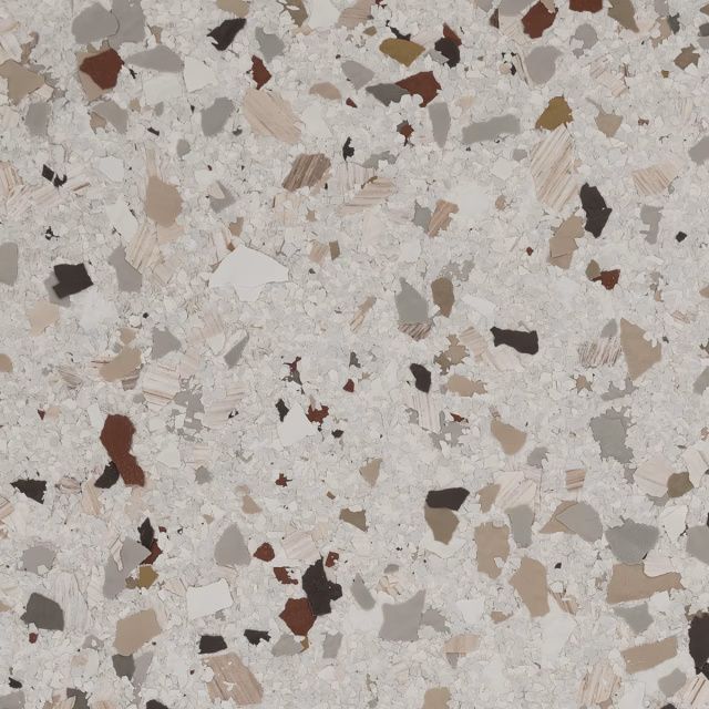 Speckled terrazzo surface with cream, beige, brown, and dark stone chips