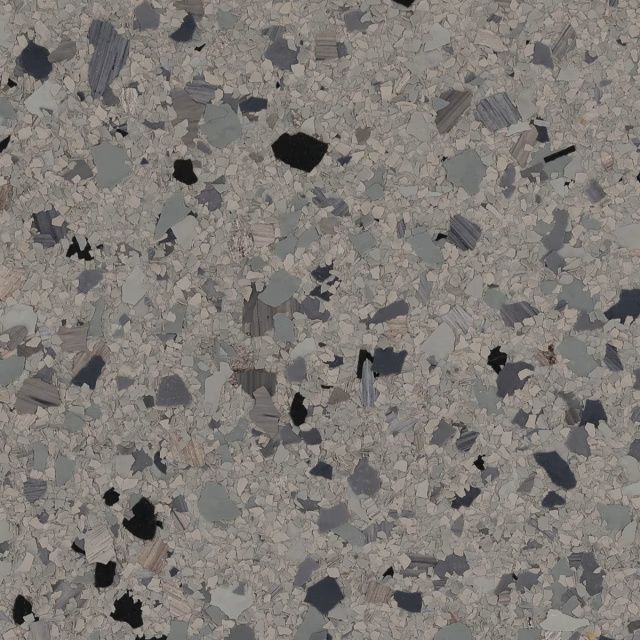 Gray speckled terrazzo surface with small black, white, and dark gray chips