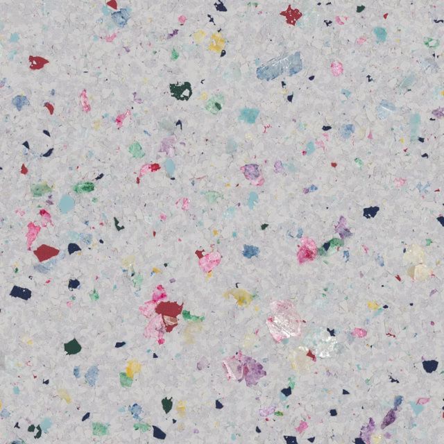 Scattered colorful confetti pieces on a light gray background