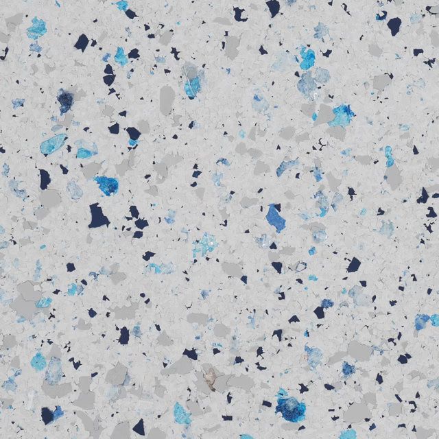 Speckled light gray terrazzo surface with scattered blue, black, and white chips