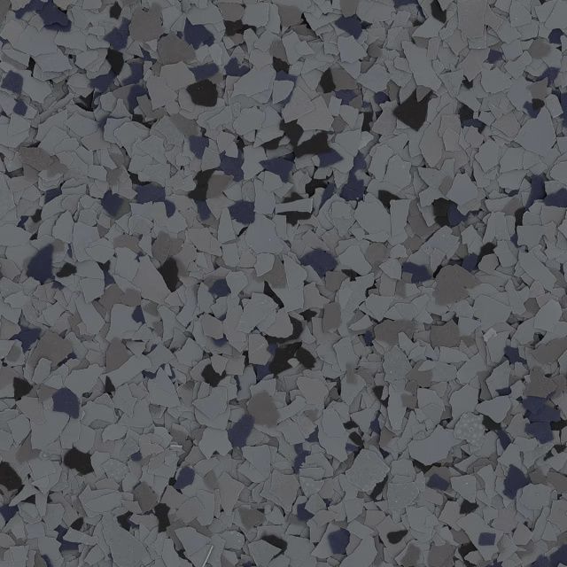 Close-up of gray and black speckled stone or tile surface with irregular flecks