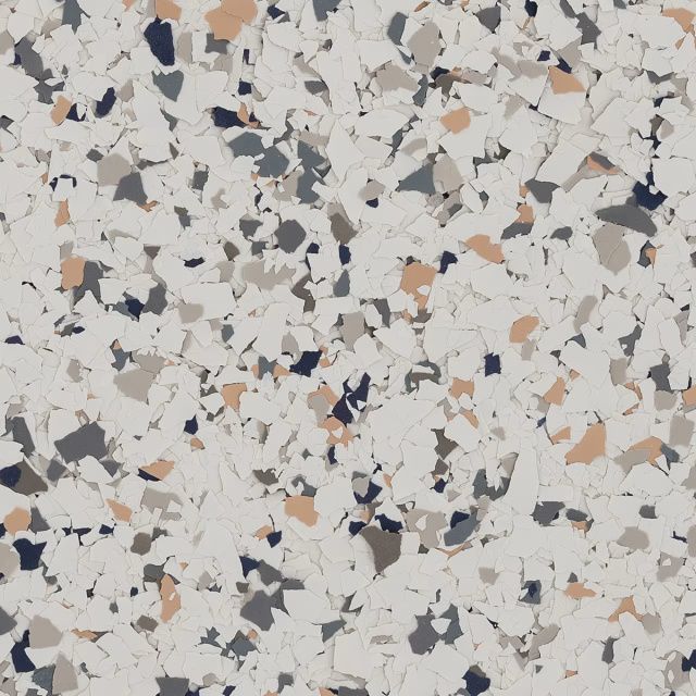 Speckled terrazzo-style surface with white, gray, black, and tan chips