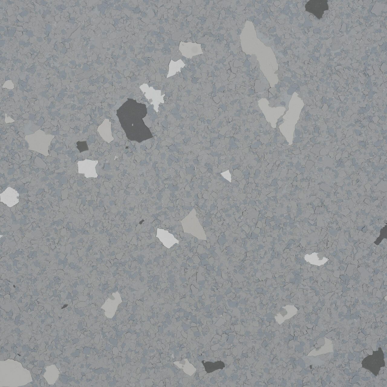 Gray speckled stone or concrete surface with scattered light and dark flecks