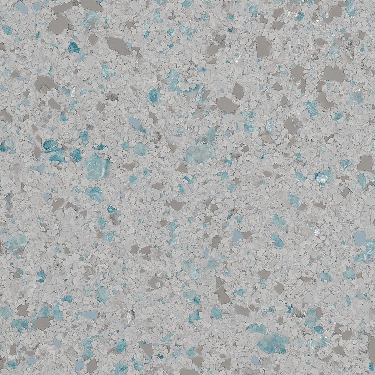 Close-up of a light gray speckled surface with scattered blue and teal flecks