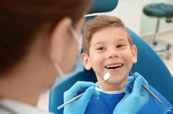 Happy child having dental check up