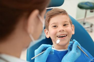 Happy child having dental check up