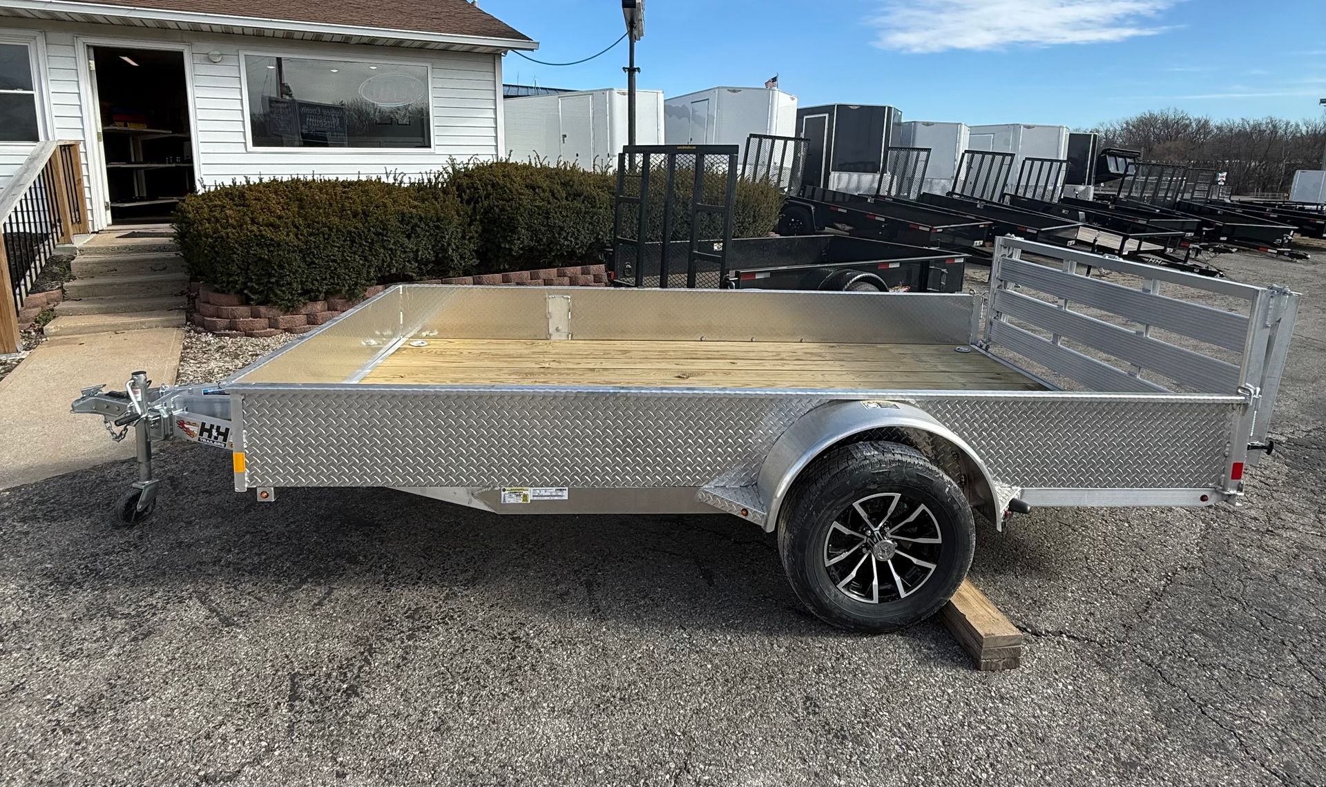 A flatbed trailer with two loading ramps