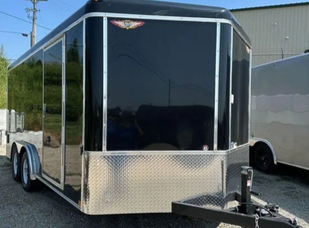 Black enclosed cargo trailer with diamond plate front.